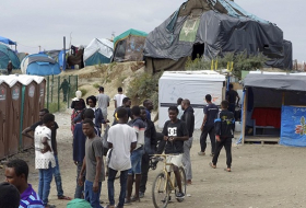 French police routinely take away Calais migrants’ shoes, phones